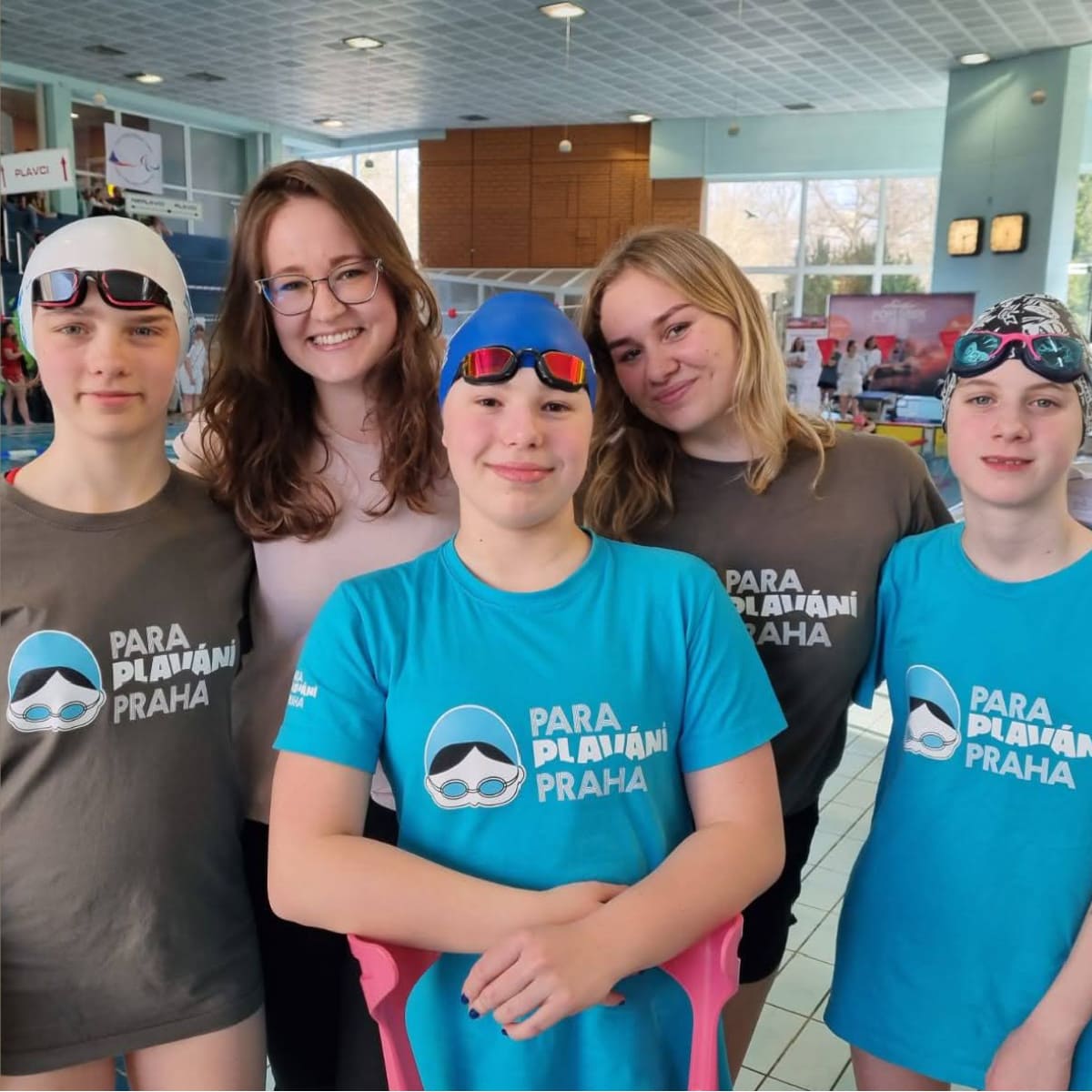 Swimmers in Para swimming t-shirts.